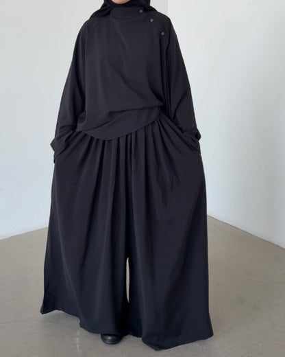 Top à bouton asymétrique noir