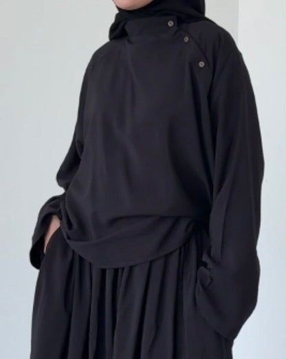 Top à bouton asymétrique noir